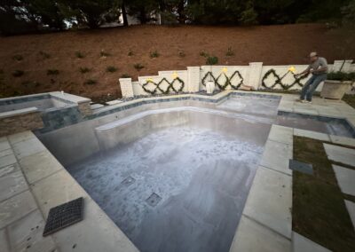 Pool under construction at the Greystone Dream project, shell formed and screen panels in place